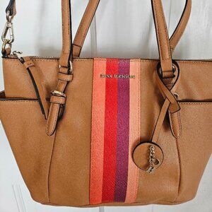 Dana Buchman tan faux leather handbag/crossbody with vertical stripes decor.